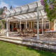 A brick deck and white pergola