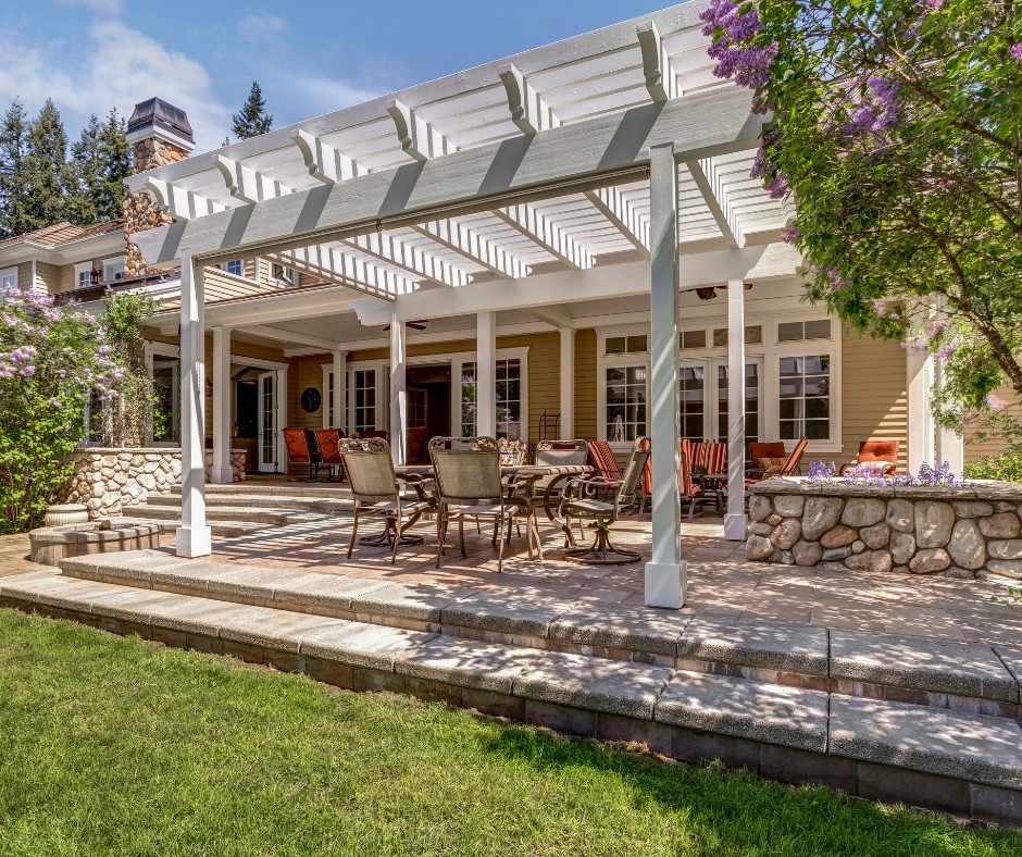 A brick deck and white pergola